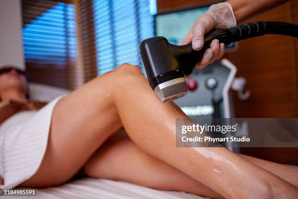 leg laser treatment in a spa setting - bare feet office stock pictures, royalty-free photos & images