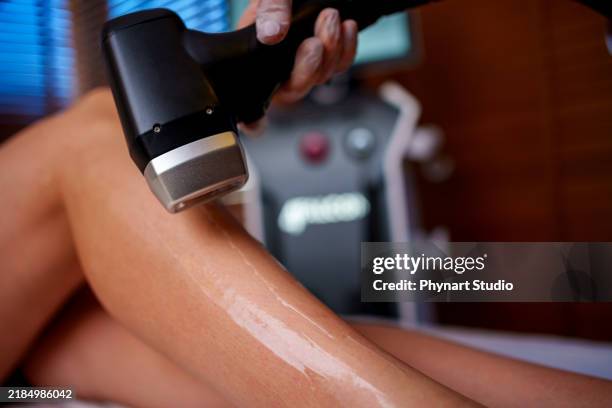 leg laser treatment in a spa setting - bare feet office stock pictures, royalty-free photos & images