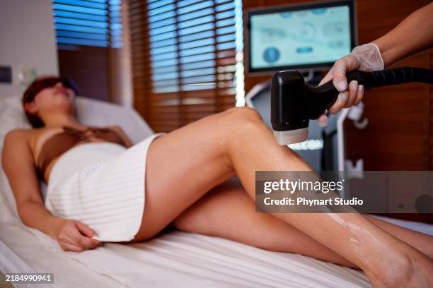leg laser treatment in a spa setting - bare feet office stock pictures, royalty-free photos & images