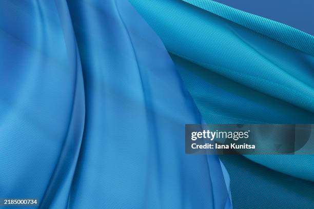 elegant blue satin fabric close-up background. abstract textile texture, 3d pattern, composition. design element. - color saturado fotografías e imágenes de stock
