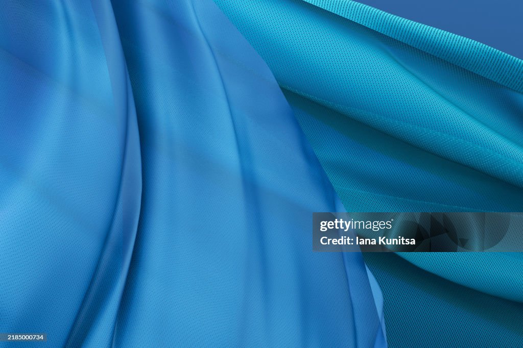 Elegant blue satin fabric close-up background. Abstract textile texture, 3D pattern, composition. Design element.