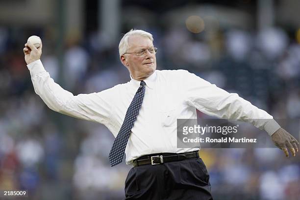 Senator Jim Bunning of Kentucky, a Hall of Fame pitcher, delivers a pitch prior to the game between the Texas Rangers and the Kansas City Royals at...