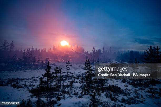 Muzzle flash lights up the British Army's new Archer Mobile Howitzer gun as it fires, as British Army soldiers take part in training near Rovaniemi...