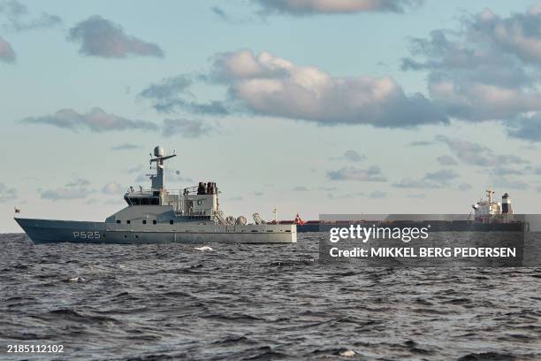 The Chinese ship, the bulk carrier Yi Peng 3 is anchored and being monitored by a Danish naval patrol vessels in the sea of Kattegat, near the City...