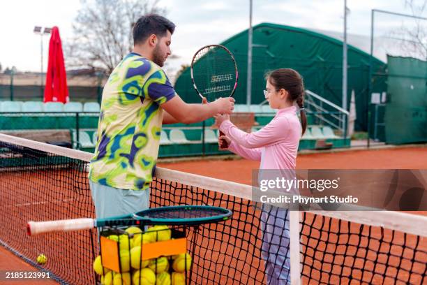 private tennis coaching session on clay court - tennis coach studio stock pictures, royalty-free photos & images