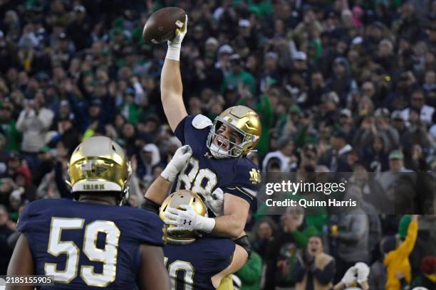 Mitchell Evans of the Notre Dame Fighting Irish reacts after scoring a touchdown in the first half against the Virginia Cavaliers at Notre Dame...