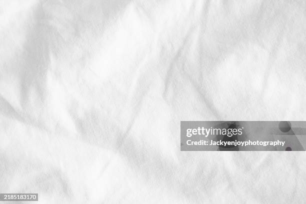 the background is a white fabric with a polyester feel. - baumwolle stock-fotos und bilder