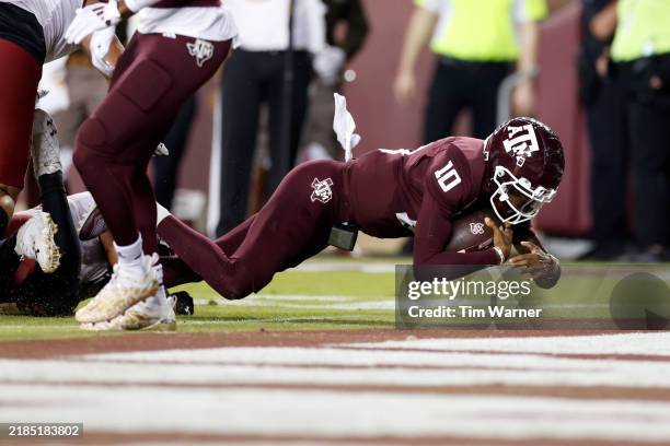 Marcel Reed of the Texas A&M Aggies dives into the end zone for a touchdown in the third quarter against the New Mexico State Aggies at Kyle Field on...