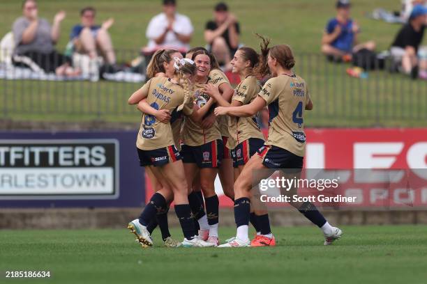 Cassidy Davis of the Jets celebrates a goal with team matesduring the round three A-League Women's match between Newcastle Jets and Wellington...