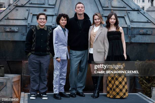 Actor Robert Timothy Smith, US actor Ravi Cabot-Conyers, British actor Jude Law, US actor Ryan Kiera Armstrong and actor Kyriana Kratter pose during...
