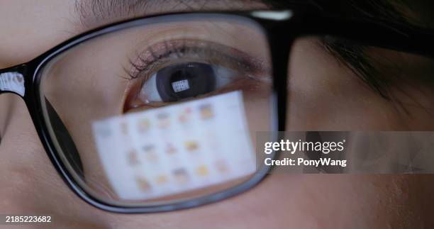woman watching shopping website - presbyopia stock pictures, royalty-free photos & images