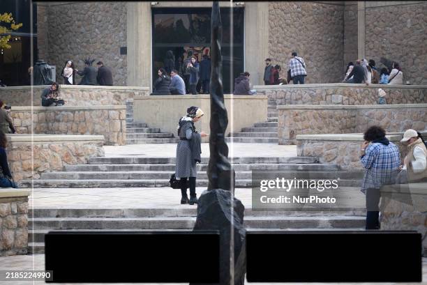 Iranian youths rest during their visit to the ''Eye to Eye, Portraiture in Modern and Contemporary Art'' exhibition at the Museum of Contemporary...