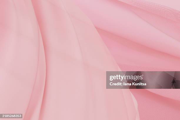 elegant pale pink satin fabric close-up background. abstract textile texture, 3d pattern, composition. design element. - pale pink stock pictures, royalty-free photos & images