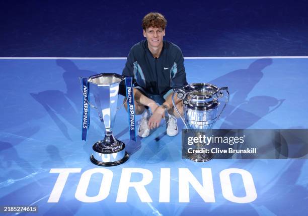 Jannik Sinner of Italy poses for a photo with the Nitto ATP Finals trophy and ATP World Number One Player trophy after his victory against Taylor...