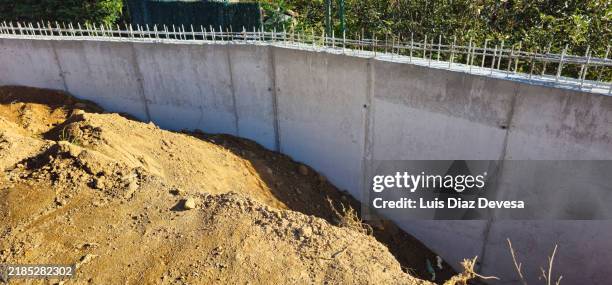 construction of a grey concrete wall. - retaining wall stock pictures, royalty-free photos & images