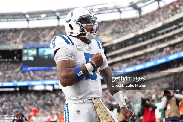 Quarterback Anthony Richardson of the Indianapolis Colts celebrates a fourth quarter touchdown against the New York Jets at MetLife Stadium on...