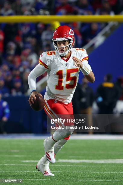 Patrick Mahomes of the Kansas City Chiefs runs with the ball during the third quarter against the Buffalo Bills at Highmark Stadium on November 17,...