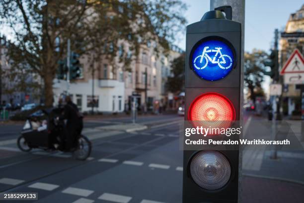 bicycle traffic signal at urban intersection - road cycling stock pictures, royalty-free photos & images