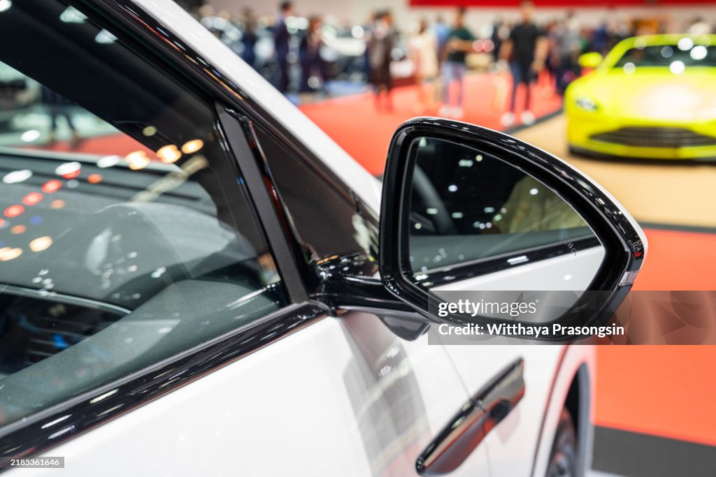Close-Up of Car Side Mirror at a Modern Auto Show