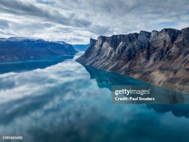 aerial view of mountain peaks in coronation fjord, baffin island, nunavut territory, canada - cliff stock pictures, royalty-free photos & images