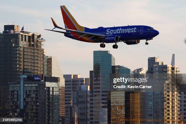 Southwest Airlines Boeing 737 airplane approaches San Diego International Airport for a landing at sunset on November 22, 2024 in San Diego,...