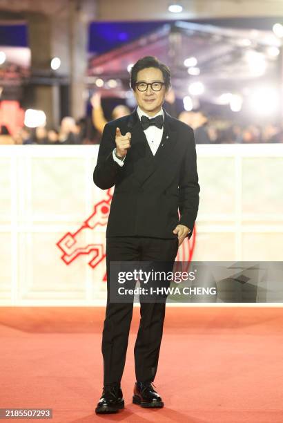 Vietnamese-born actor Jonathan Ke Quan arrives on the red carpet to attend Taiwan's 61th Golden Horse film awards ceremony in Taipei on November 23,...