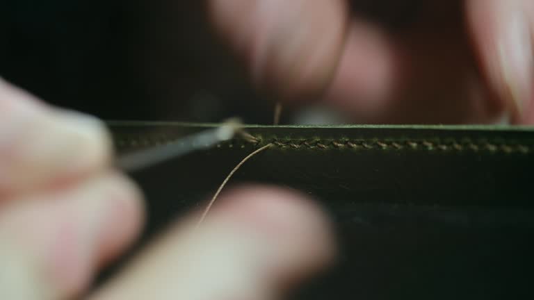 https://media.gettyimages.com/id/2185513685/video/shoemaker-stitching-leather-with-needle-and-thread.jpg?b=1&s=640x640&k=20&c=6TIXkGglmt5TpvL_LbYl9zA9KVc6SuBGapYkxjU_N0Y=