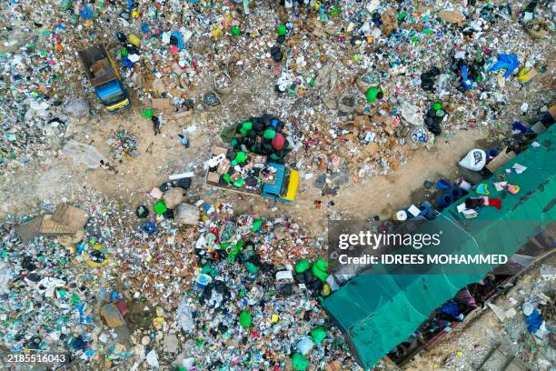 An aerial view shows plastic waste at a landfill on the outskirts of Bengaluru on November 23, 2024.