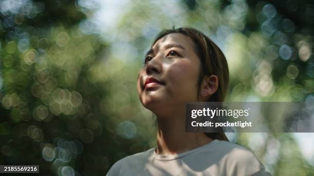 woman resting at nature. - person silhouette looking up stock pictures, royalty-free photos & images