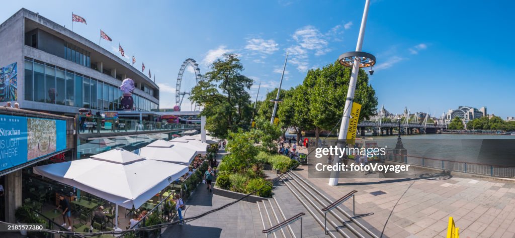 London Southbank restaurants along busy Thames Embankment cityscape panorama