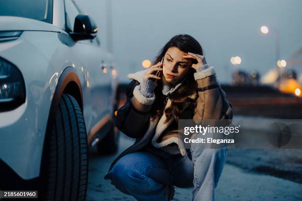 woman with phone is calling in service of car - damaged stock pictures, royalty-free photos & images