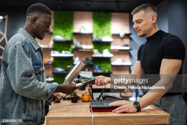 paying for my shoes - digital counter stock pictures, royalty-free photos & images