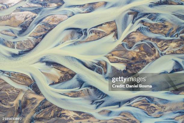 abstract aerial drone view of river texture along icelandic southern coast - riverbed stock pictures, royalty-free photos & images