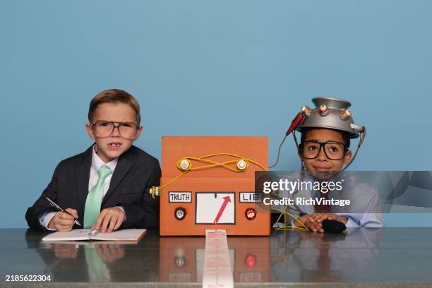 boys with homemade lie detector machine - polygraph stock pictures, royalty-free photos & images