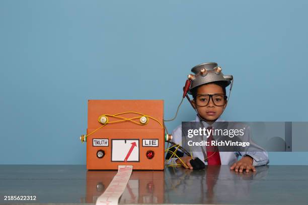 boy with homemade lie detector machine - polygraph stock pictures, royalty-free photos & images