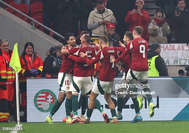 Dominik Szoboszlai of Hungary celebrates with teammates after scoring his team's first goal from the penalty spot during the UEFA Nations League...