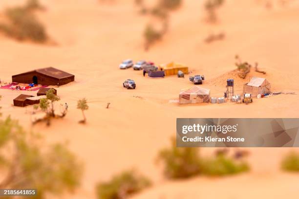 making camp in the sahara desert morocco - merzouga stock pictures, royalty-free photos & images