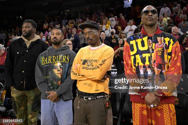 Chad Easterling, CEO of Obsidianworks, actor Michael B. Jordan, fashion designer Tracy Mills and rapper Snoop Dog attend the game between the USC...