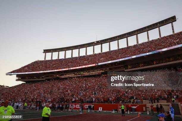 Texas Longhorns fans hold up their cell phone flashlights during the Texas Fight chant during the SEC college football game between Texas Longhorns...