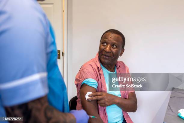 "the injection is all done" - vaccination stock pictures, royalty-free photos & images