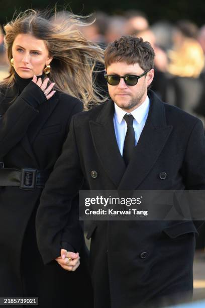 Amelia Woolley and Niall Horan depart the funeral for singer Liam Payne, former member of One Direction, on November 20, 2024 in Amersham, England....
