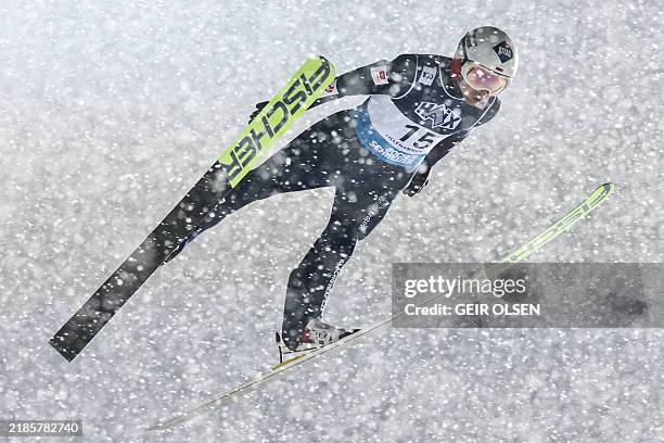 Kamil Stoch from Poland soars through the air during the men's individual competition of the FIS Ski Jumping World Cup at the Lysgardsbakken venue in...