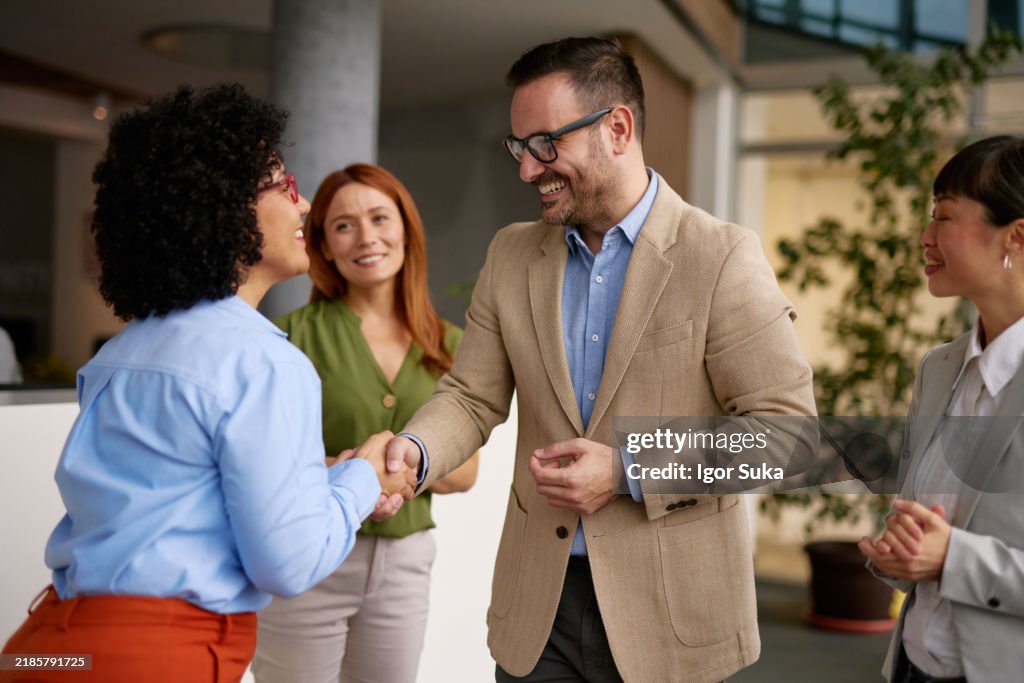 Diverse Business Team Meeting and Greeting Each Other