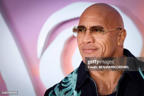 Actor Dwayne Johnson poses on the red carpet upon arrival for the UK Premier of "Moana 2", at the Cineworld, in Leicester Square, in central London,...