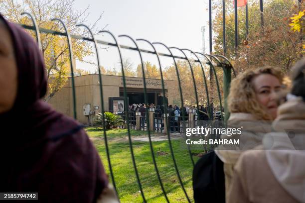 Visitors gather at the entrance of the Tehran Museum of Contemporary Art for the "Eye to Eye" exhibition, Tehran, Iran, November 23, 2024. The...