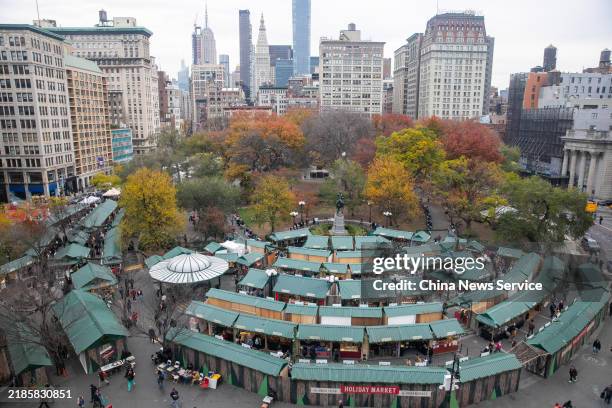 People visit Union Square holiday market on November 20, 2024 in New York City. A massive European-style winter market just opened in Union Square,...