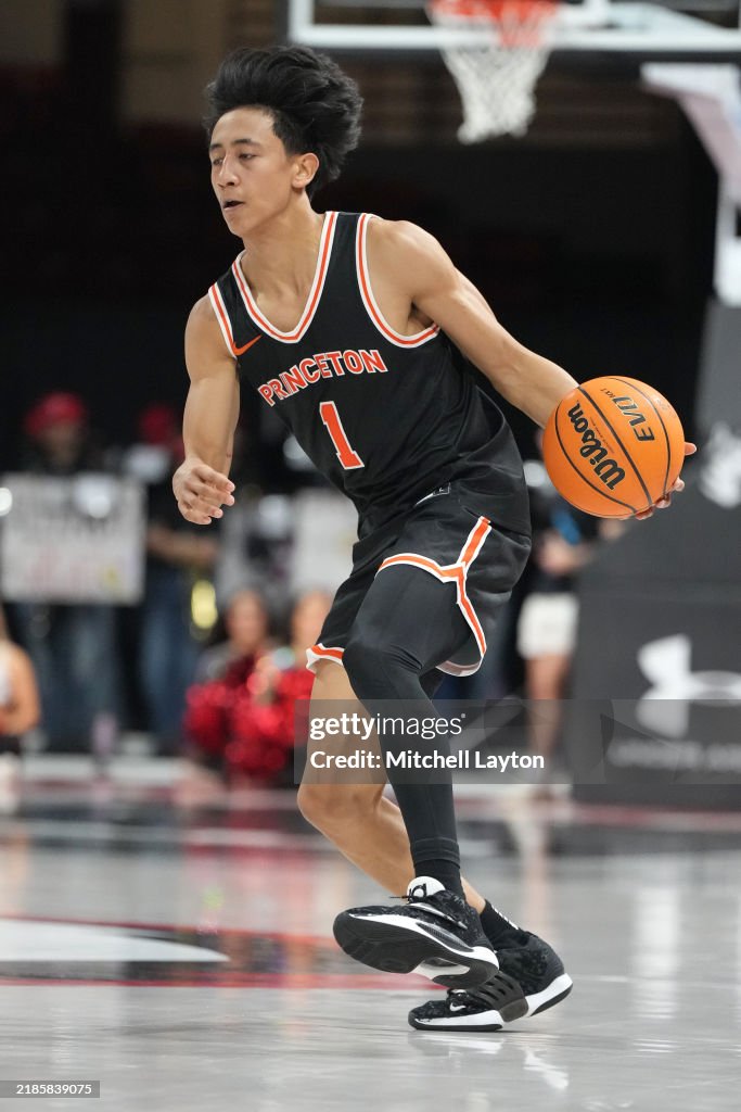 Xaivian Lee of the Princeton Tigers dribbles the ball during a... News