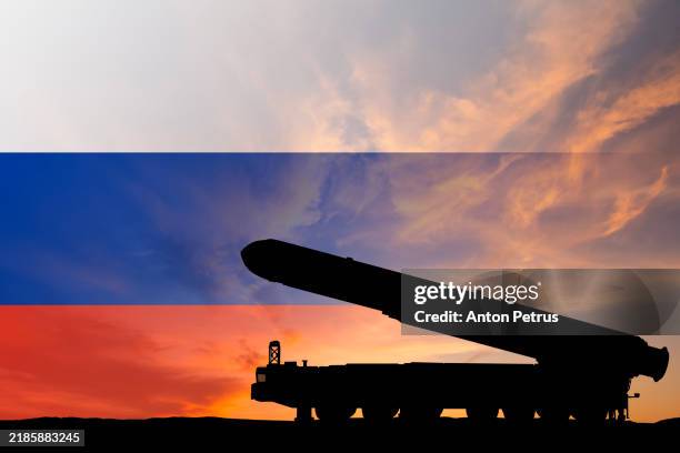 ntercontinental ballistic missile on the background of the flag of russia - russia stock pictures, royalty-free photos & images