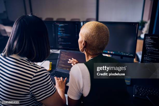 computer programmers discussing code on laptop and desktop screens - web design stock pictures, royalty-free photos & images