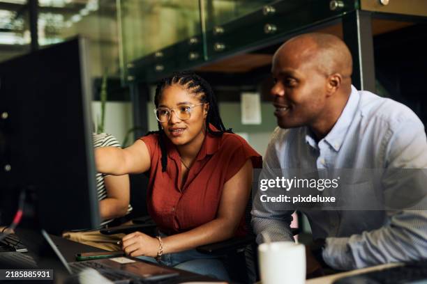 computer programmers collaborating on software development project in office - software development team stock pictures, royalty-free photos & images